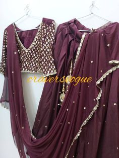 This bollywood style lehanga is made in silk fabric which is high in quality  Blouse is having handwork of sequins on sleeves ,in front,and big patch of work at the back Dupatta in georgette with lace border.lace is also made by handembridoidry. It can be customize in any size But extra charges for xl sizes We use high quality fabric at craversvogue After you purchase the dress we customize in your size as soon as we get the measurements. We dont sell any kind of replicas rather we create designs with our own efforts thats why you get unique products and best quality at craversvogue. Our team is expert in customization field. We are connected to you through messages during customization. Fitted Pre-draped Saree With Gota Work For Designer Wear, Anarkali Pre-draped Saree With Dabka Work, Fitted Gota Work Pre-draped Saree In Chanderi, Fitted Chanderi Saree With Gota Work, Fitted Pre-draped Gota Work Saree In Chanderi, Fitted Chanderi Pre-draped Saree With Gota Work, Fitted Pre-draped Saree With Gota Work In Chanderi, Fitted Pre-draped Saree With Dabka Work For Party, Floor-length Chinon Lehenga With Dabka Work