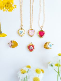 "♥️ Lovely unused 50s vintage tiny heart lockets with different finishes and chains available: tiny real pearls necklace, gold plated and raw bass chain. They measure 15mm x 14mm. PLEASE keep in mind these are very old tiny lockets made of brass, and most of them have patina and little stains due to the passage of time. This enhances their vintage condition and shows their real age. Hinges and closures all in good working condition. Limited stock as they aren't produced nowadays. PLEASE see all Vintage Open Heart Locket Necklace For Valentine's Day, Antique Gold Heart Locket Necklace With Vintage Charm, Valentine's Day Antique Gold Locket Necklace With Vintage Charm, Vintage Brass Locket Necklace For Valentine's Day, Heart-shaped Antique Gold Locket Necklace For Valentine's Day, Gold Locket Necklace, Real Pearl Necklace, Heart Locket Necklace, Gold Locket