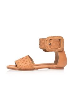 These leather sandals are made to order from high quality soft leather. Delight in the craftsmanship of these jaw dropping Madagascar leather sandals. Featuring woven leather upper with braided accents and large decorative leather bound buckle these sandals will keep you sleek and chic anywhere you go. Style them with your mini wrap dress to elevate your everyday casual look or with your floaty maxi skirt for a super chic style. -Smooth leather lining and insole with embossed logo -Lightly padde Bohemian Woven Leather Beach Sandals, Bohemian Woven Leather Sandals For Beach, Woven Leather Ankle Strap Sandals, Adjustable Woven Leather Closed Toe Sandals, Brown Bohemian Woven Sandals, Brown Leather Woven Sandals, Bohemian Leather Sandals With Buckle Closure, Adjustable Leather Sandals With Woven Sole, Braided Leather Ankle Strap Sandals