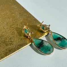 18KT yellow gold + cabochon, bezel set emerald teardrop earrings. Beautiful, unique emeralds were hand picked from Colombia. Measures: 63mm x 19mm 37 CT emeralds Omega backs Fine Jewelry With Cabochon Drop, Fine Jewelry Drop Cabochon, Luxury Green Teardrop Earrings, Luxury Teardrop Cabochon Jewelry, Teardrop May Birthstone Earrings, Luxury Pear-shaped Emerald Earrings, Emerald Cabochon Earrings As A Gift, Emerald Cabochon Earrings For Gift, Fine Jewelry Emerald Teardrop Earrings