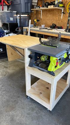 a workbench in a garage with tools on it, including a table sawhorse