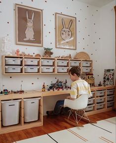 a child's room with lots of storage and toys on the floor, including bins