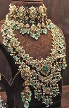 an elaborate necklace and earring set on display