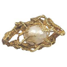 Circa 1960s Arthur King 18k Yellow Gold Free Form Brooch, measuring 1 3/4 inches in length X 1 inch and weighing 16.6 Grams, centrally set with a Natural Fresh Water Pearl measuring 14 x 12 M.M. Dark Water, Ring Inspo, Gold Brooch, Best Engagement Rings, Antique Brooches, Gold Brooches, Fresh Water Pearl, Pearl Brooch, Pretty Rings