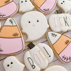 decorated cookies are arranged on a table