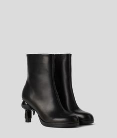 Featuring a playful, 3D Ikonik Karl-molded heel, these mid-length boots epitomize KARL LAGERFELD statement style. Heel Boots For Women, Umbrella Man, Heel Accessories, Beach Wear Dresses, Backpack Travel Bag, Boot Accessories, Shopper Tote, Evening Clutch Bag, Boots And Sneakers