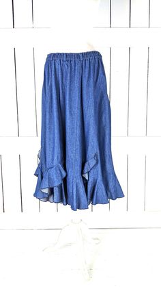 "Vintage blue ruffle flowy long denim jean skirt Measurements...taken flat -marked size: no label -across waist: 15\"-20\" -length: 33\" Features... -medium weight cotton denim -cool ruffle tiered detail -stretch waist -lovely drape and flow -unlined Condition: -excellent vintage condition -gently worn" Spring Denim Blue Flare Skirt, Denim Blue Flare Skirt For Spring, Spring Flare Denim Blue Skirt, Cotton Tiered Denim Skirt With Ruffles, Fitted Denim Skirt With Ruffles, Spring Long Skirt With Ruffle Hem, Medium Wash Denim Tiered Skirt, Denim Blue Ruffled Cotton Skirt, Fitted Denim Ruffled Skirt