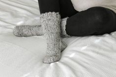 "Stay cozy in the cold weather with these hand knit Cottage Socks! These warm socks feature thick wool/acrylic blend yarn. Choose from over 30 colors! The sizing in the drop-down menu shows US shoe sizes with their approximate measurement in inches. *Colors shown in photos: Gray Marble, Pumpkin* Processing Time: This item is Made To Order and takes approximately 1 to 2 weeks to complete before it will be shipped to you. If you require a Rush Order, please message me, and I will give you a new es Cozy Knitted Socks, Cozy Chunky Knit Socks With Round Toe, Comfortable Knitted Gray Socks, Cozy Chunky Knit Socks, Cozy Handmade Socks For Stocking Stuffers, Cozy Knitted Snug Socks, Winter Knitted Yarn Socks, Cozy Knitted Yarn Socks, Cozy Hand Knitted Yarn Socks