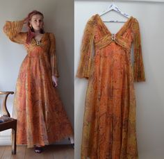 An absolutely amazing vintage 1960s evening dress. Made by English designer Susan Small.  Such a stunning and vibrant piece - this dress is made with orange psychedelic print organza, with concertina pleated sleeves which are gathered across the chest. Finished with a chunky diamante buckle to the front.  Made with a wide flared skirt and a high waist-line which finishes under the bust.  In wearable vintage condition. There is some marking to the under skirt, and a small whole, but none of it sh 1800's Dress, Under Skirt, Full Skirt Dress, Pleated Sleeves, 1920s Dress, Folk Fashion, Birthday Party Dress, Star Dress, Flared Skirt