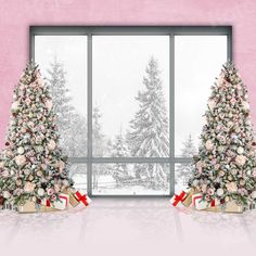 two decorated christmas trees in front of a large window with pink walls and snow outside