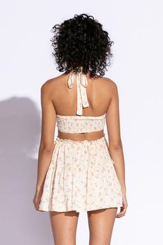 STYLE INFORMATION: Get your Texas boho vibes on in the Sundown Peach Floral Print Sundress!. Peach floral print Swiss dot fabric shapes this cute dress that has a halter V-neckline with tie straps, and a cutout waist.. The open back wraps around to the sides to create a cutout effect above the attached mini skirt. Ruffle trim and side ties decorate the cutout waist. DETAILS & CARE: Rayon/Polyester. Dry Clean. Imported. SHIPPING: We offer free shipping for all orders in the Continental US. Spring V-neck Halter Dress With Crisscross Straps, Spring Mini Dress With Wrap-around Straps, Summer Mini Dress With Wrap-around Spaghetti Straps, Spring Sundress Halter Dress With Adjustable Straps, Spring V-neck Halter Top With Tie Back, Summer Halter Dress With Adjustable Straps For Spring, Spring/summer Halter Dress With Adjustable Straps, Spring Summer Halter Dress With Adjustable Straps, Summer Halter Top With Spaghetti Straps For Brunch