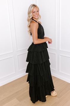 - Step into a stylish dream with this flowy tiered maxi! The halter-tied neckline evokes a sense of effortless grace, while the delicate cutout accent gives it a flirty touch. Perfect for sunlit strolls and moonlit nights, this gorgeous dress will keep you feeling fabulous no matter the occasion. - Fully lined lightweight material - A halter-tied neckline - Pleated detailing as well as a cutout accent at the bodice - An open back - Low back zip closure - A fitted waistline - A flowy tiered silho Tiered Maxi Dress, Gorgeous Dresses, Bodice, Sense, Matter, Maxi Dress, Black