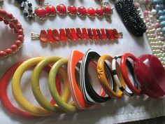 Beautiful vintage lot from 1940s - 1980s plastic Bakelite Lucite, sterling Lucite Faux pearls  and Celluloid jewelry all in good vintage condition. You will find 36 bracelets, 1 belt, 12 necklaces, 9 pair of earrings, 1 fur clip, 1 ring, and 6 brooches with some signed pieces such as Design by Paula, Meriam Haskell, Coro, Lisner, Monet, Avon and more. Due to the size of the lot all sales are final. Retro Handmade Bangle Jewelry, Retro Multicolor Bracelet Jewelry, Vintage Bakelite Bracelet, Retro Multicolor Round Jewelry, Vintage Multicolor Bracelets For Formal Occasions, Multicolor Round Retro Jewelry, Vintage Lucite Bangle Bracelet, Vintage Bakelite Bangle Jewelry, Vintage Bakelite Bangle