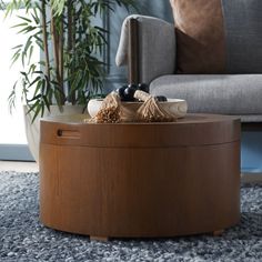 a living room with a couch, chair and coffee table on carpeted flooring