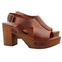 The handcrafted brown heeled sandals are a perfect combination of tradition, high quality and modernity to wear. Versatile and comfortable, they are ideal for all-day wear. Women's clogs with brown wood effect base Upper in brown leather, with two lateral notches Padded insole in leather Adjustable ankle strap 8 cm wide heel + 2.5 cm plateau Stable and light Made entirely by specialized Italian personnel Handcrafted products using the best materials. BEFORE PURCHASING DO NOT FORGET TO CHECK THE Elegant Brown Sandals With 4-inch Heel, Brown High Heel T-strap Sandals For Summer, Summer Brown High Heel T-strap Sandals, Brown Open Toe Clogs With 4-inch Heel, Summer Slingback Pumps With Wooden Heel And Round Toe, Summer Open Toe Clogs With 4-inch Heel, Elegant Brown Open Toe Block Heels, Brown High Heel T-strap Sandals For Spring, Brown Sandals With Heel Strap And Round Toe