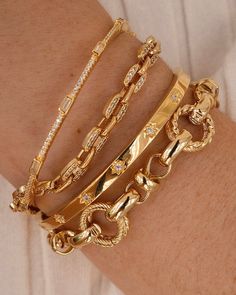 We love to throw on some chunky chains to elevate our everyday stack, and the Atlas bracelet is the perfect piece to add to your collection. We love the different textures and patterns on this bracelet - dress it up for a night out, or dress it down with your favorite sweater. 18k Gold Vermeil Luxury Bracelet Stack Silver And Gold, Luxury Minimalist Gold Bracelet, Tarnish Resistant, Luxury Bracelets With Intricate Design For Celebration, Luxury Timeless Bracelets With Shiny Finish, Luxury Minimalist Gold Bracelet Tarnish Resistant, Cheap Gold Beaded Bracelets As Gift, Luxury Diamond Accented Bracelets As Gift, Cheap Gold Beaded Fun Bracelets, Luxury Crystal Bracelet As A Gift