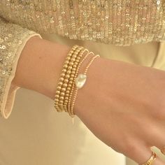 Elevate your wrist with our Gold-Filled Beaded Bracelet adorned with a lustrous freshwater pearl accent. This elegant piece combines the warmth of gold with the timeless beauty of pearls, creating a bracelet that effortlessly complements your style and adds a touch of sophistication to any ensemble. Handmade in the USADETAILS:-Material: 14K Gold-filled Natural Freshwater Pearl ( due they are natural pearls may vary the size and shape) Bead size 2mm What is 14k Gold-Fiiled ? Gold-filled jewelry i Elegant Handmade 14k Gold-filled Pearl Bracelet, Elegant 14k Gold-filled 8mm Beaded Bracelets, Elegant Yellow Gold 14k Gold-filled Pearl Bracelet, Adjustable 14k Gold-filled Pearl Bracelet, Adjustable 14k Gold-filled Elegant Pearl Bracelet, Extraordinary Jewelry, Gold Bond, A Bracelet, Oils For Skin