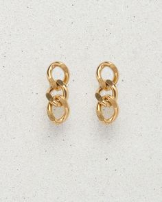 Three perfect 18k gold plated lil' links make Damien an earring somewhere between a drop earring or a stud. When you just need a teeny bit of dangle, Damien is your go-to pair. Classic, lightweight, and a nice alternative to a hoop. Made from premium quality materials, st. Moran jewelry is designed to last. At our atelier, we believe in crafting jewelry to withstand everyday wear without tarnishing. Gold Tarnish-resistant Drop Cartilage Earrings, Gold Tarnish-resistant Dangle Cartilage Earrings, Single Link Earring In Metal, Trendy Gold-tone Dangle Earrings, Tarnish Resistant Metal Dangle Cartilage Earrings, Gold Plated Drop Cartilage Earrings, Trendy Gold-tone Pierced Earrings, Trendy Single Gold-tone Earring, Trendy Gold-tone Single Earring