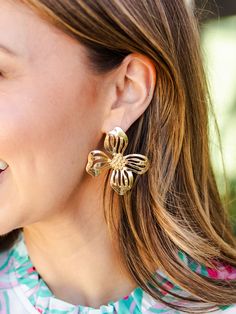 Blossom into spring with our timeless Alani Earrings. Featuring an organic shaped flower stud, these earrings introduce a delicate touch of floral sophistication to your everyday outfit. Organic shaped flower stud earrings 2.25" Brass plated Hypoallergenic Surgical steel posts Nickel and lead-free Feminine Drop Earrings For Spring, Spring Flower Pierced Earrings, Delicate Flower Earrings For Spring, Chic Spring Jewelry With Flower Charm, Spring Wedding Flower Earrings For Pierced Ears, Delicate Flower Charm Earrings For Spring, Delicate Drop Earrings For Spring, Delicate Flower Shaped Earrings For Spring, Delicate Flower-shaped Earrings For Spring