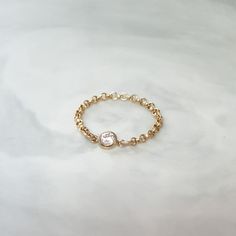 Simple. Chic. Minimalist™ A perfectly dainty CZ diamond chain ring, made with top quality 14K Gold filled and Cubic Zirconia stone. Ring sizes are in US All parts are made with 14k Gold filled and will last a lifetime! Also available with Sterling silver or 14K Rose gold filled. Model is wearing 6.5US size Please visit this link to see more of my stacking rings collection: https://www.etsy.com/shop/miniLALI?section_id=15703796&ref=shopsection_leftnav_6 My shop: https://www.etsy.com/shop/mini Yellow Gold Stackable Midi Rings With Cubic Zirconia, Stackable Yellow Gold Midi Rings With Cubic Zirconia, Stackable Cubic Zirconia Midi Rings In Yellow Gold, Diamond Stackable Chain Ring For Promise, Dainty Diamond Midi Rings With Round Band, Dainty Cubic Zirconia Stackable Rings, Minimalist Cubic Zirconia Stackable Rings, Dainty Stackable Rings With Cubic Zirconia, Everyday Diamond Stackable Midi Rings