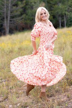 Embrace the floral frenzy with our Celeste Dress. This full-length frock features a feminine flower pattern that will effortlessly brighten your day. The smocked, figure-flattering bodice and ultra-sweet puff sleeves nicely balance the twirl-worthy skirt, creating the perfect summer ensemble for romantic date nights or family-filled picnics at the park. STYLE INFO & CARE The smocked bodice for a flexible, comfortable fit Tiered Skirt Fully lined 100% polyester Tie detail in the back Maternity fr Romantic Dates, Floral Maxi, Tier Skirt, Perfect Summer, Floral Maxi Dress, Brighten Your Day, Puff Sleeve, Flower Patterns, Date Night