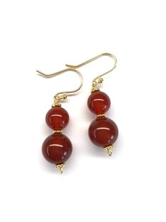 This pair of earrings are made with carnelian (red agate) beads and gold plated sterling silver. - Made with genuine carnelian beads, gold-plated sterling silver beads, gold-plated sterling silver wires and gold-plated sterling silver hooks - Approximately 38 mm / 1.5 inches in length of the earrings - Approximately 8 mm diameter of small carnelian bead and 10 mm diameter of big carnelian bead Visit my shop for more: http://www.etsy.com/ca/shop/RitaCollection If you have any questions regarding Carnelian Gemstone Dangle Earrings, Carnelian Dangle Earrings With Natural Stones, Carnelian Drop Earrings With Natural Stones, Carnelian Natural Stones Dangle Earrings, Carnelian Natural Stone Drop Earrings, Elegant Amber Round Bead Earrings, Amber Carnelian Gemstone Earrings, Spiritual Agate Gemstone Earrings, Carnelian Dangle Jewelry With Matching Earrings