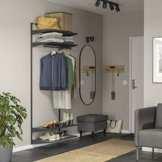 a living room filled with furniture and a coat rack on top of a wooden shelf