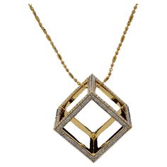 Presenting a masterfully crafted piece of artistry, features a captivating geometric pendant that exudes modern elegance. The luxurious pendant boasts a sleek gold finish, forming an open cube shape that makes a bold statement. Adorning the edges of this contemporary design is a meticulously arranged pavé of sparkling diamonds, providing a striking contrast against the polished gold surface. It's a versatile accessory, perfect for adding a touch of glamour to any ensemble, and is sure to be a treasured addition to any jewelry collection. This pendant is not just an accessory; it is a wearable piece of modern art that speaks to those who dare to stand out. THE STONES- This necklace consists of a round diamond weighing 1.625 carats. There are 336 pieces of round diamonds. The diamonds are of Modern Diamond Cut Square Pendant Necklace, Modern Square Pendant Necklace With Diamond Cut, Modern Formal Necklace With Rectangular Pendant, Modern Gold Square Pendant Jewelry, Modern Gold Necklace With Square Pendant, Gold Rectangular Necklace For Evening, Rectangular Gold Necklace For Evening, Modern Yellow Gold Square Pendant Jewelry, Modern Square Pendant Jewelry With Diamond Cut