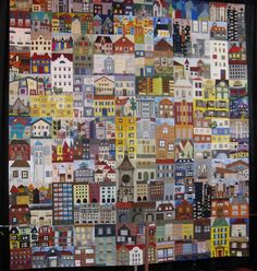 a large colorful cityscape is on display in front of a black backdrop with white trim