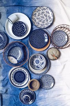 many plates and bowls are arranged on a table