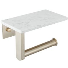 a white marble and brass toilet paper holder