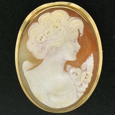 Here we have a very nice vintage cameo pendant or brooch. The frame is solid 14k yellow gold and features a simple polished finished. The pin and locking mechanism on the back are in perfect working order. The bail on the back of the piece swivels up for wear as a pendant or down when wearing it as a brooch. The inside of the bail measures approximately 4.8x3.5mm. (Please be sure to take into account areas of a clasp that may be thicker than the chain itself when measuring your chain.) A very ni Classic Oval Cameo Brooch, Antique Oval Cameo Brooch, Gold Oval Cameo Brooch, Classic Yellow Gold Cameo Brooches, Yellow Gold Oval Cameo Brooch, Oval Cameo Brooch For Anniversary, Classic Gold Oval Brooch, Classic Gold Oval Brooches, Classic Oval Brooches For Collectors