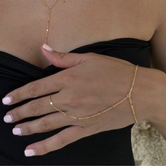 Dainty 18k gold plated/platinum plated hand chain. Our hand chain is so flattering and comfortable to wear. Our chain is sparkly and sits so beautifully on the hand. Layer with some of your favourite rings and bracelets. We have always been obsessed with hand chains so we created our own. Hand chains are so dainty and give that extra sparkle and shine to your hands. Measurements:  Bracelet - 6.5-7" inches (comes with extra adjustable 2" chain extender) Wrist to finger - 7 cm Please feel free to Finger Chain Bracelet, Permanent Hand Chain, Elegant Adjustable Chain Link Ring, Handchains Gold, Delicate Adjustable Gold Chain Ring, Minimalist Delicate Chain Bracelet For Party, Minimalist Adjustable Gold Chain Ring, Elegant Gold Chain Adjustable Ring, Elegant Adjustable Gold Chain Ring