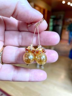 Another pair by perfectionist Laura Maddams Bentley.  These are perfect to ring in the New Year.  Golden, classy orb combo just the right size.  14k gold filled earwire. Faceted Amber Jewelry For Wedding, Elegant Hypoallergenic Glass Jewelry, Hypoallergenic Round Glass Jewelry, Gold Wire Wrapped Jewelry For Anniversary, Elegant Citrine Wire Wrapped Jewelry, Gold Round Faceted Jewelry, 14k Gold Amber Round Jewelry, 14k Gold Round Amber Jewelry, Round 14k Gold Amber Jewelry