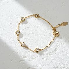 The Lots of Love Bracelet is a heartfelt ode to affection and warmth. Crafted from 18K gold plated brass, this piece is a tangible representation of love's enduring bond. It's a reminder that love comes in many forms, each one precious and worth cherishing. Wear it as a symbol of the love you give and the love you receive, a circle of joy that envelops your wrist. PRODUCT DETAILS Materials: 18K Gold Plated, 316L Stainless Steel Bracelet Length: 6.7 - 8 inch / 17-20.5 cm Includes bracelet Gold Bracelet With Adjustable Chain For Valentine's Day Gift, Delicate Gold Bracelets For Valentine's Day, Delicate Gold Bracelet For Valentine's Day, Dainty Gold-plated Bracelet For Gift, Dainty Gold Plated Bracelet For Gift, Adjustable Plated Chain Bracelet As Gift, Adjustable Plated Chain Bracelet For Gift, Delicate Gold Bracelet As Gift, Gold-tone Brass Chain Bracelet As Gift