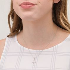 She'll wear this effortless cross pendant day after day. Fashioned in sterling silver, this precious choice features a sculpted beaded cross adorned with diamond accents - each artfully set to enhance size and sparkle. Buffed to a brilliant luster, this pendant suspends along an 18.0-inch rope chain that secures with a spring-ring clasp. Sterling Silver Crucifix Necklace In Fine Jewelry Style, Fine Sterling Silver Crucifix Necklace, Fine Jewelry Silver Crucifix Necklace, Silver Crucifix Necklace In Fine Jewelry Style, Sterling Silver Cross Pendant Necklace, Fine Jewelry Sterling Silver Cross Necklace, White Diamond Accented Crucifix Jewelry, Fine Jewelry Crucifix With Diamond Accents, Elegant Sterling Silver Crucifix Necklace