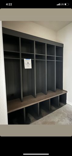 an empty room with some shelves and no one is in the photo or there is also a sign on the wall