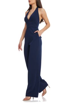 A plunging neckline draws attention to this stunning wide-leg jumpsuit with an open back and handy pockets. 48" length (size Small) Halter neck Adjustable tie straps 96% polyester, 4% spandex Machine wash, line dry Imported Backless Jumpsuit With Tie Back For Night Out, Backless Strapless Jumpsuit For Summer Formal, Summer Formal Backless Strapless Jumpsuit, Elegant Evening Strapless Maxi Jumpsuit, Elegant Formal Strapless Overall Jumpsuit, Open Back Jumpsuit, Elegant Strapless Backless Jumpsuit For Formal Occasions, Chic Strapless Backless Jumpsuit For Formal Events, Elegant Strapless Backless Jumpsuit For Date Night