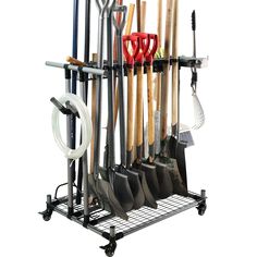 a rack with shovels, rakes and other tools