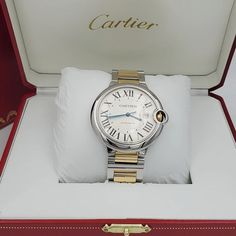 Men's Cartier 42mm Ballon Bleu Two Tone 18K Yellow Gold / Stainless Steel Watch with Roman Numeral Silver Dial and Smooth Bezel. Includes Box and Papers. Ballon Bleu de Cartier watch, 42 mm. Mechanical movement with automatic winding, caliber 1847 MC. Steel case, 18K yellow gold (750/1000) fluted crown set with a cabochon synthetic spinel. Silver guilloché dial. Blued-steel sword-shaped hands. Sapphire crystal. Calendar aperture at 3 o’clock. Two-tone interchangeable bracelet. Thickness: 13 mm. Designer Gold Watches For Wedding, Designer Gold Wedding Watches, Elegant Automatic Diamond Watch For Anniversary, Designer White Gold Watches For Anniversary, White Gold Automatic Watch For Formal Occasions, Designer Cartier Watch, Designer Automatic Watch For Formal Occasions, Luxury Jewelry And Watches With Round Dial For Wedding, Anniversary Yellow Gold Watches With Skeleton Dial