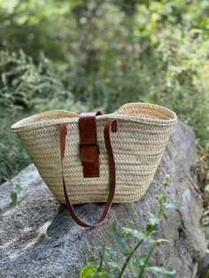 Elevate your style with this stunning natural Moroccan handmade straw bag. Expertly crafted by skilled artisans, this spacious bag combines functionality and elegance, making it perfect for everyday use or a day at the beach. The intricate weaving showcases traditional Moroccan craftsmanship, while the durable leather straps provide comfort and style. With its roomy interior, it effortlessly accommodates your essentials, from beach towels to groceries. Embrace the charm of Moroccan culture and make a sustainable fashion statement with this beautiful, eco-friendly accessory. Natural Fiber Straw Bag With Double Handle, Braided Rectangular Straw Bag, Natural Color Braided Rectangular Shoulder Bag, Natural Colored Braided Rectangular Shoulder Bag, Natural Braided Rectangular Shoulder Bag, Chic Straw Bag For Market, Natural Straw Bag With Double Handle For Market, Handwoven Natural Straw Bag, Natural Double Handle Straw Bag For Market