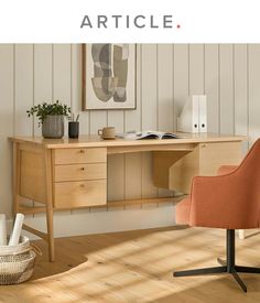 a desk with an orange chair in front of it and the words article above it