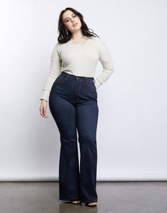 Take a trip to the past in our Curve 70s Girl Flared Jeans! Features a high-waisted cut that hugs the waist perfectly, a simple dark blue wash, and bell bottoms. These jeans are made from 49% rayon, 32% cotton, 17% polyester, and 2% spandex. Made in the USA. Model is 5'6", bust 40", waist 29", hips 45" and is wearing a size 1XL. Curvy Flare Jeans, Plus Size Bottoms, Mid Size Flare Jeans Outfits, High Rise Jeans Outfit Curvy, Flare Jeans Plus Size Outfit, Outfits For Petite Curvy Women, Curvy Body Outfits, Plus Size Flare Jeans Outfits, Flared Jeans Plus Size