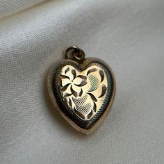 Cute hollow gold filled heart pendant with decoratve etching.  Pre-loved item. Stamped GF for gold filled BIRKS. Size: 2cm tall, 1.5cm wide.  Weight: 1.479g **FREE shipping within Canada and USA** If you have any questions or concerns, please do not hesitate to contact us. We will be more than happy to help you and answer any inquiries.  We invite you to check out our shop for more fabulous items! Vintage Gold Heart Charm Necklace, Vintage Gold Heart Pendant Necklace, Vintage Yellow Gold Heart Charm Necklace, Vintage Yellow Gold Heart Necklace, Heart-shaped Gold Jewelry With Vintage Charm, Gold Heart Necklace With Vintage Charm, Antique Gold Jewelry With Heart Charm, Vintage Charm Heart-shaped Yellow Gold Jewelry, Gold Engraved Heart Pendant Necklace