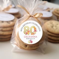 cookies wrapped in cellophane and tied with a ribbon for an 80th birthday celebration