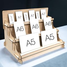 a wooden stand with four different types of cards on it