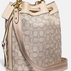 This Is A New Coach Bucket Bag 2 Way. 11”W 10h.Fabric Monogram With Leather Trim .Leather Top Handle With Adjustable Crossbody Strap.Hardware Is Gold.Comes With Dustbag Chic Monogram Canvas Bag For Errands, Chic Formal Monogram Canvas Bag, Monogram Canvas Satchel Bucket Bag With Gold-tone Hardware, Chic Monogram Canvas Satchel For Errands, Designer Beige Bucket Bag, Chic Everyday Monogram Canvas Bag, Chic Monogram Canvas Bags, Elegant Monogram Canvas Bag For Errands, Chic Everyday Shoulder Bag In Monogram Canvas