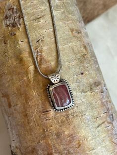 Rhodochrosite stone bezel set in sterling silver with silver plated chain to match. Clasp closure. Handmade with love Artisan Sterling Silver Rectangular Necklace, Sterling Silver Square Pendant With Natural Stones, Silver Jewelry With Large Rectangular Stone, Silver Sterling Silver Necklace With Rectangular Stone, Elegant Rhodonite Jewelry Gift, Silver Rectangular Pendant With Natural Stones, Elegant Rhodonite Jewelry For Gifts, Silver Jewelry With Rectangular Natural Stones, Rectangular Stone Jewelry Perfect For Gifts