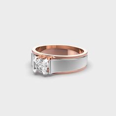 a white and rose gold ring with a single diamond