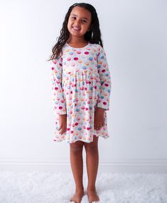 This dreamy dress is made to make any toddler twirl with joy! Soft bamboo fabric and long sleeves keep them comfy and stylish while they explore, frolic, and flutter through their day! Who said playtime has to be boring? 93% Bamboo and 7% spandex Wash cold with like colors; stays soft wash after wash Long Sleeve Twirl Ready Playful Cotton Loungewear Dress, Comfortable Casual Twirl Dress For Playtime, Flowy Casual Twirl Dress For Playtime, Casual Flowy Twirl Dress For Playtime, Playful Spring Twirl Dress For Playdate, Playful Long Sleeve Dresses For Playwear, Playful Long Sleeve Playwear Dresses, Playful Ruffled Dress For Sleepovers, Fun Long Sleeve Spring Dresses